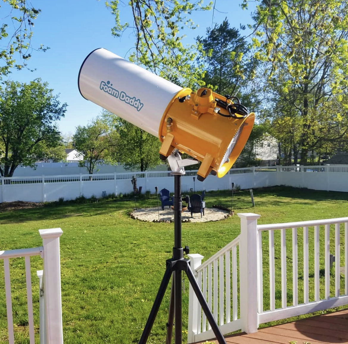 Professional FoamDaddy foam cannon set up in a backyard